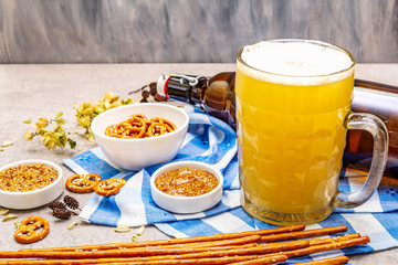 Oktoberfest set. Light beer, pretzels, mustard, sesame straw, hop.
