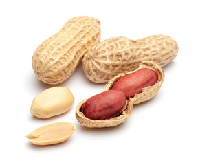 Dried peanuts in peel closeup isolated on white background