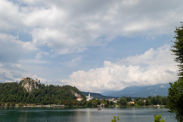 Fototapeta premium View of Bled Lake with Ducks and small church on the Island. Slovenia, Bled Lake