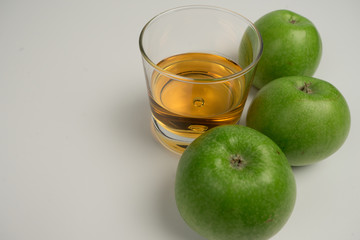 Fruit Series. green Apples, pears, figs and a glass with tasty juice