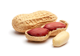 Dried peanuts in peel closeup isolated on white background