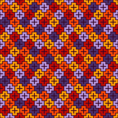 Fototapeta premium Repeated puzzle mosaic background. Seamless pattern in Halloween traditional colors with simple geometric ornament.