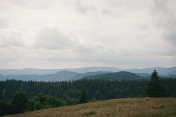 Fototapeta na wymiar Hiking in the Low Tatra mountains in Slovakia, almost alone on the ridgeway, only majestic mountains