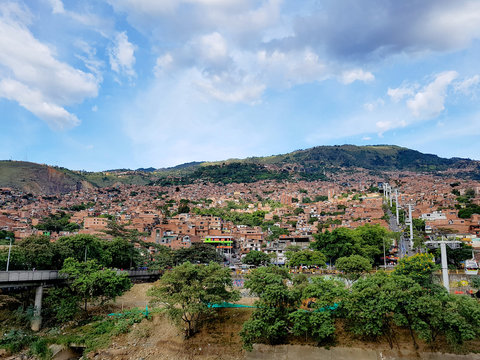 People enjoy a healthy trip in the public park Arvi in the city of Medellin, with a lot of trees, wood bridge and a river