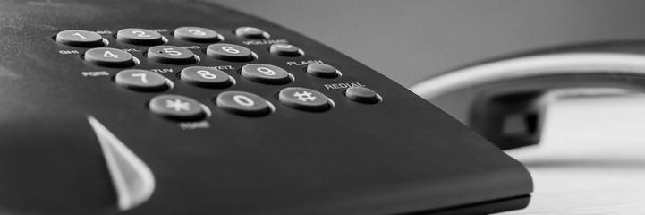 Wide view image of black landline telephone keypad