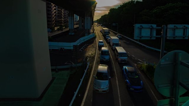 A timelapse of downtown street at Kanpachi avenue in Tokyo daytime wide shot panning