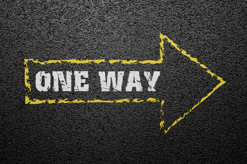 One way sign on asphalt ground