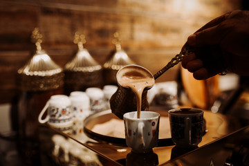 Turkish coffee in the cup. traditional turkish coffee. close up - obrazy, fototapety, plakaty