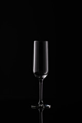 empty champagne glass on black background