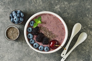 Organic chia seeds smoothie with blackberries, cherries, blueberries and yogurt. Healthy food. Smoothie bowl. Top view. 