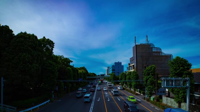 A timelapse of downtown street at Kanpachi avenue in Tokyo daytime wide shot panning