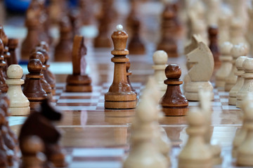 Chess, Board game. The game concept. Developing the abilities of using old games. People of different ages playing at the tables in rapid chess