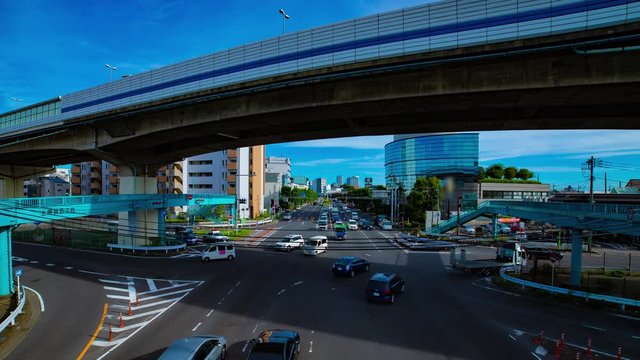 A timelapse of downtown street at Kanpachi avenue in Tokyo daytime wide shot panning