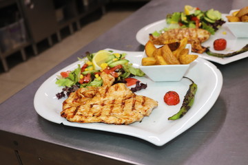 grilled chicken with vegetables on plate