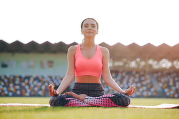 girl with a beautiful body doing yoga exercises.