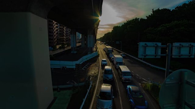 A timelapse of downtown street at Kanpachi avenue in Tokyo daytime wide shot panning