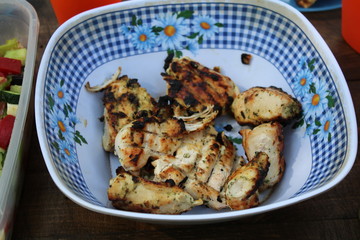 Roast meat in a plastic plate.