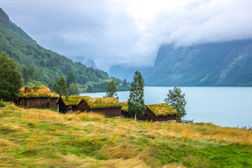 Obraz premium old farm on Lovatnet lake in Norway