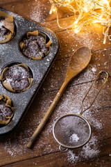 Baking tin with a tasty chocolate muffins
