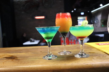 two cocktails on black background