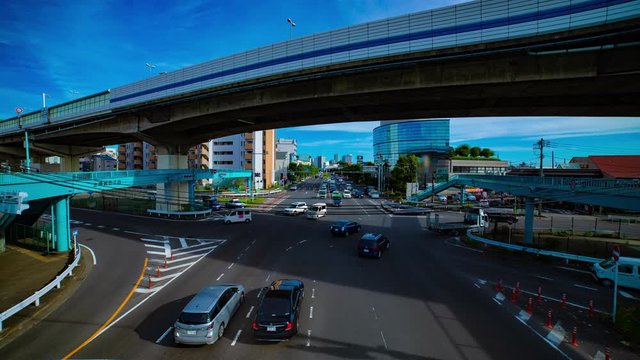 A timelapse of downtown street at Kanpachi avenue in Tokyo daytime wide shot tilt
