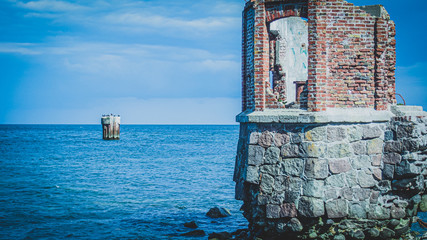 Destroyed tower at the coast