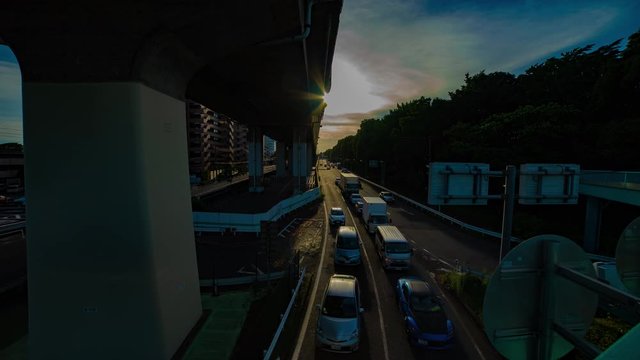 A timelapse of downtown street at Kanpachi avenue in Tokyo daytime wide shot tilt