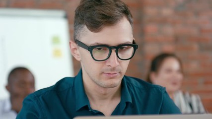 Tired Exhausted Overworked Male Office Worker Rubs his Eyes under Glasses and has Headache after Long Work on Laptop. 4K Static Close Up Shot