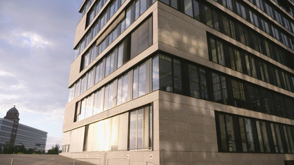 Obraz premium Modern Office Building with Glass Facade