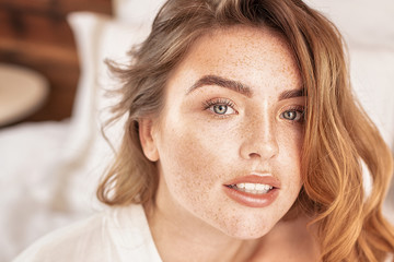Naklejka premium Beauty portrait of woman with freckles.