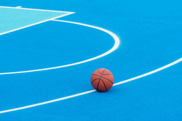 Orange Basketball ball on the blue surface