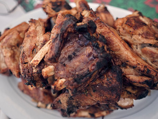 pork ribs golden brown over the grill on a table