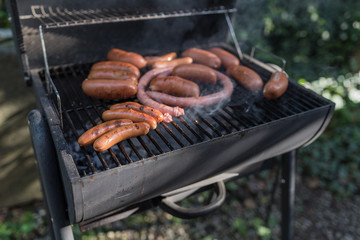 Barbecue sausages are grilled in the yard.