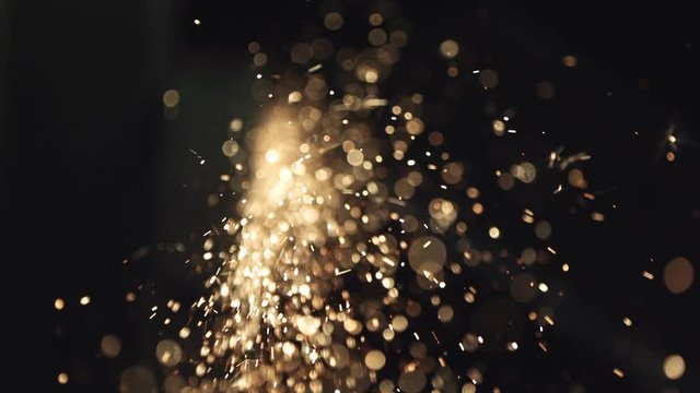 Slow motion, bokeh industrial sparks fly