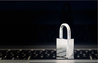 Computer Security Concept with a Closed Padlock on the Keyboard on Black Background
