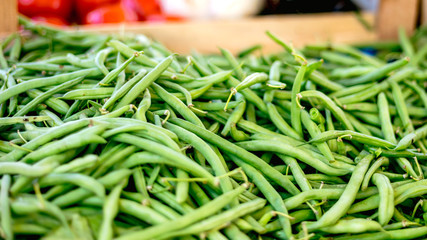 Fresh green pea pods at the morning vegetable farmer's market