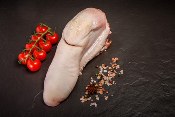 top view on raw beef tongue with spices and tomatoes cherry