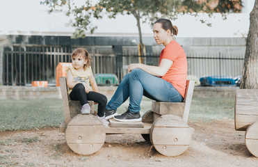 mother and daughter playing in the park