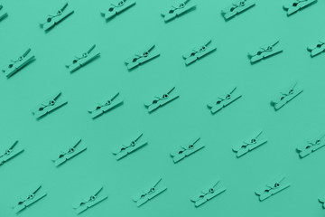 Pattern with clothes pins. Green monochrome theme. Horizontal.