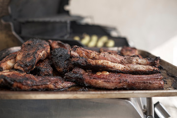 pork ribs golden brown over the grill on a table