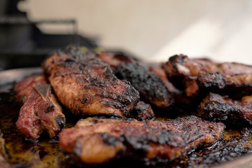 pork ribs golden brown over the grill on a table