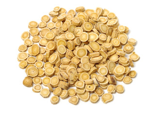 Chinese Herbal medicine - Astragalus slices, Huang Qi (Astragalus propinquus) on white background 