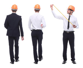 in full growth .a qualified architect in an orange helmet