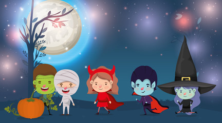 Obraz na płótnie Canvas halloween card with kids costumed in the dark night scene