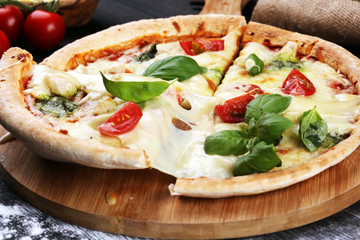 vegetarian italian Pizza with tomatoes, mozzarella cheese  and basil. Delicious italian pizza