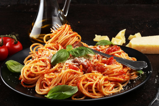Plate of delicious spaghetti Bolognaise or Bolognese with savory minced beef and tomato sauce garnished with parmesan