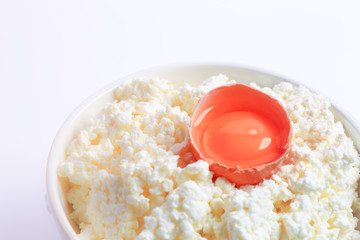 cottage cheese with a broken egg