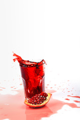 pomegranate juice on a white background