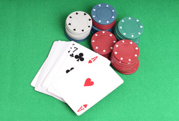 Chips for casino with on green background