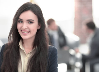 Face of beautiful woman on the background of business people.